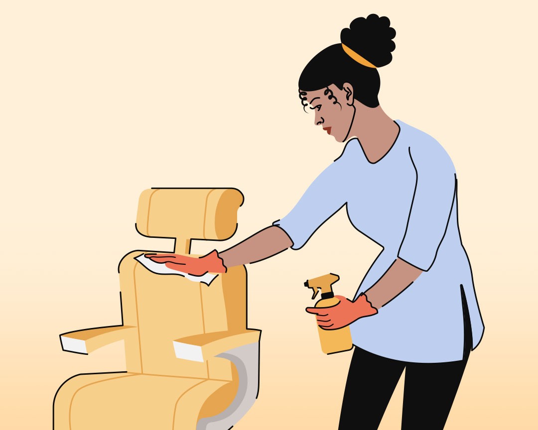 hairstylist cleaning salon chair